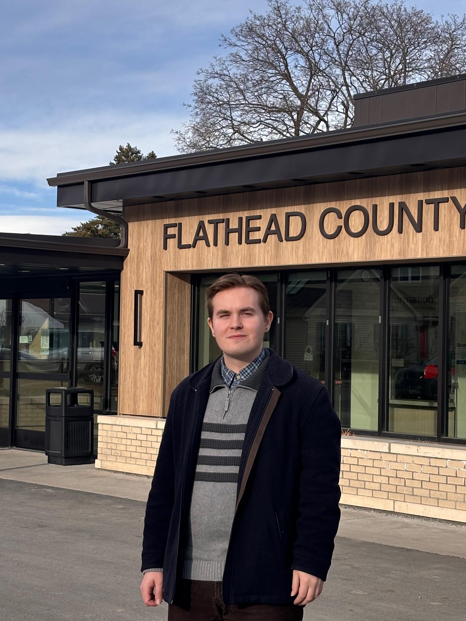Colton Little in front of the Flathead County Building